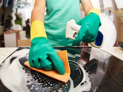 Team following safe cleaning practices in a workplace