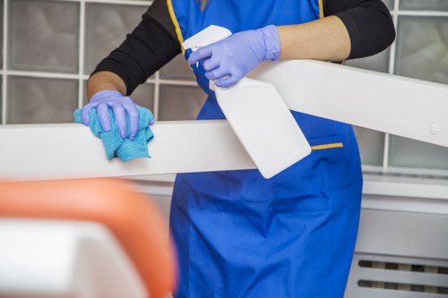 Cleaner wearing PPE while carrying out a careful service
